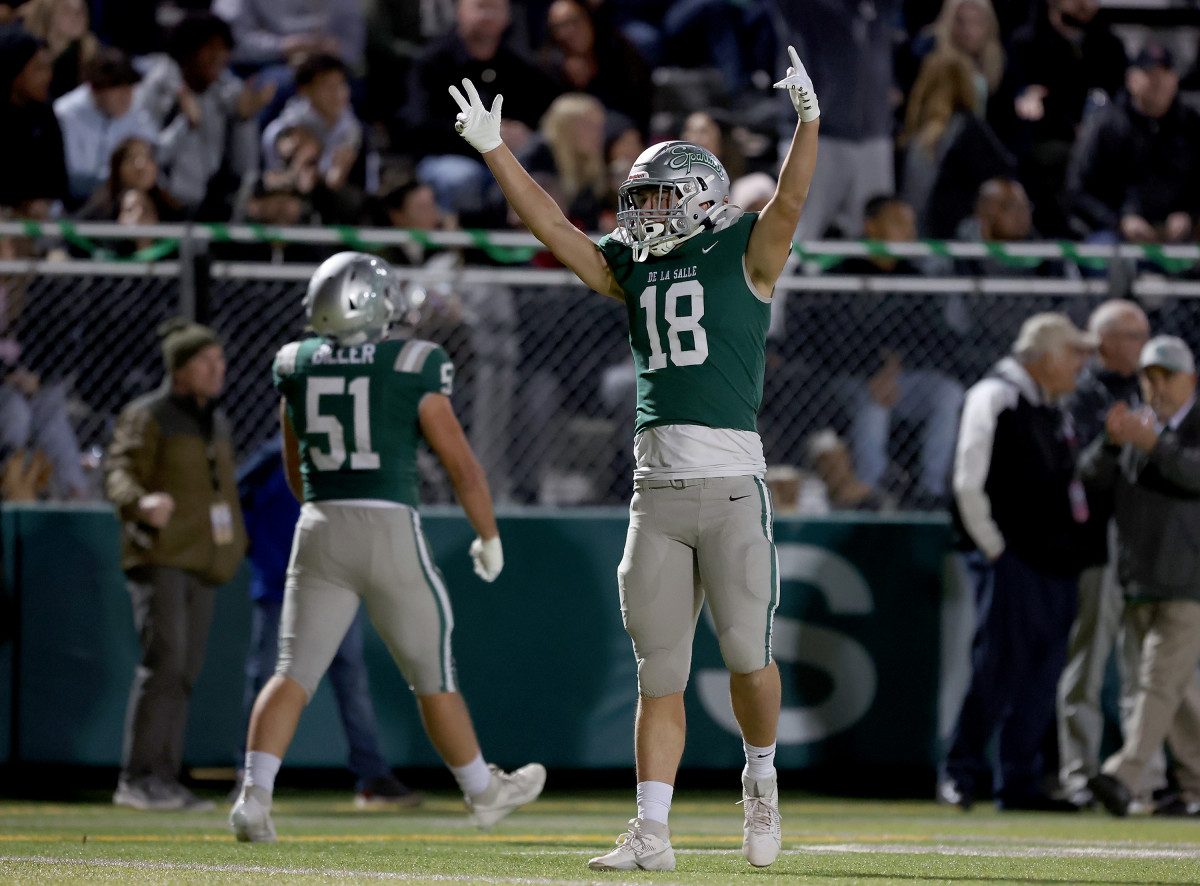 Drew Cunningham (18) and Chris Biller (51) celebrate 41-0 win over Clovis North in the CIF Division 1-AA championship game on Dec. 1. 